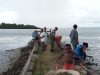 Karya Bhakti Babinsa Bersama Warga Bersihkan Pantai Wisata