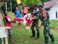 Bangkitkan Semangat Nasionalisme, Satgas Yonif 762/VYS Kibarkan Bendera Merah Putih Bersama Warga Kampung Di Daerah Operasi Penugasan
