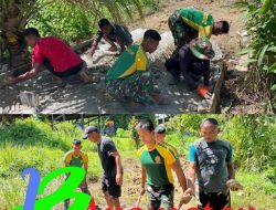 Satgas Pamtas Yonarmed 11 Kostrad Bersama Warga Lumbis Hulu Bangun Rabat Beton