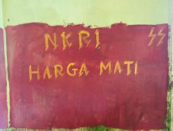 Satgas Habema Cat Ulang Tembok Bertanda Bintang Kejora dengan Tulisan Bernuansa Nasionalisme