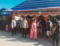 Bhabinkamtibmas Polsek Air Besar Berikan Pelayanan dan Pengamanan di Acara Pesta Pernikahan Warga