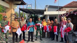 Sambut HUT RI ke-80, Koramil dan Forkopimcam Kemusu Bagikan Bendera Merah Putih Ke Masyarakat
