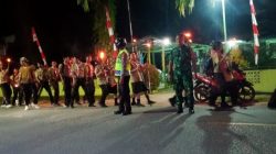 Personil Polsek Mempawah Hulu berikan Pengamanan dan Pengawalan Kegiatan Pawai Obor