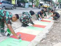 Guyub Rukun, Satgas TMMD Reguler Ke-125 Kodim 0735/Surakarta Laksanakan Pengecatan Lis Jalan Dan Penutup Saluran Air