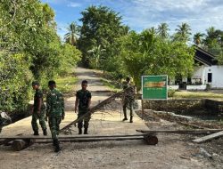 TMMD Ke-127 Kodim 1804/Kaimana Laksanakan Pembersihan Perbaikan Jembatan di Kampung Marsi