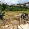 Satgas Yonif 645 GTY Pos Muara Nawa Melaksanakan Kegiatan Membangun Gereja Di Distrik Airu