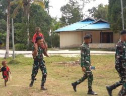 Senyum Anak-Anak Warnai Hasil Pembangunan Jalan Cor 250 Meter TMMD Ke-129 di Kampung Sesor